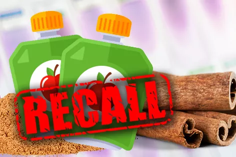 A graphic of two green plastic containers with images of fruit on the label and the word RECALL over them